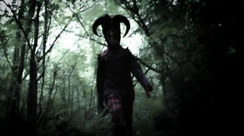 4k Halloween Shot of a Child in Joker Costume Following the Camera Stock Footage