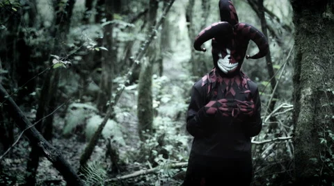 4k Halloween Shot of a Child in Joker Costume Looking and Playing with Fingers Stock Footage