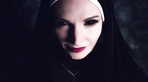 4k Halloween Shot of a Horror Nun Turning Evil from Dark Stock Footage