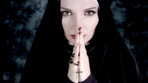 4k Halloween Shot of a Horror Woman Praying with Cross Stock Footage