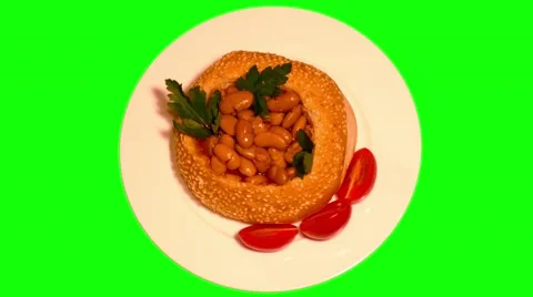 4k hamburger bun full of beans in tomato sauce with vegetables Stock Footage 49615052