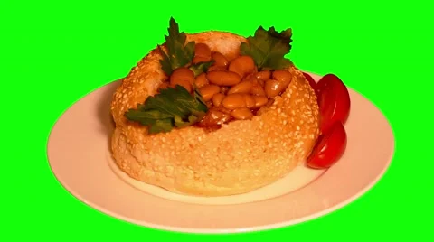 4k hamburger bun full of beans in tomato sauce with vegetables Stock Footage 50015475