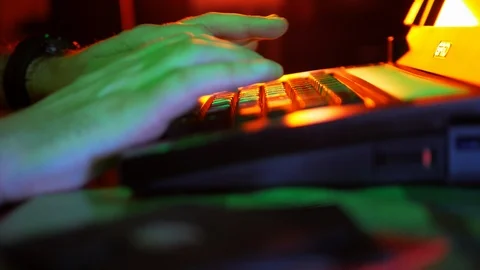 4k Hand close-up of developer who typing text code at retro old laptop in dark Stock Footage 87182418