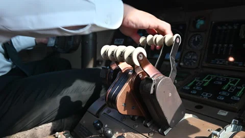 4K Hand of pilot push back the lever and thrust reverse for landing plane Stock Footage 149190172