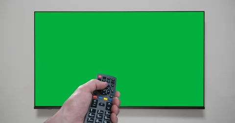 4K - Hand with remote control changes channels tv. Green screen. Chroma key Stock-Footage 102252674
