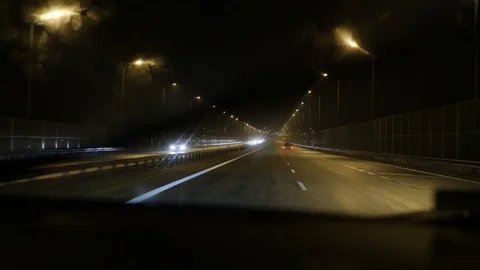 4K handheld shot looking out the front window of a car driving on a Stock Footage 101247220