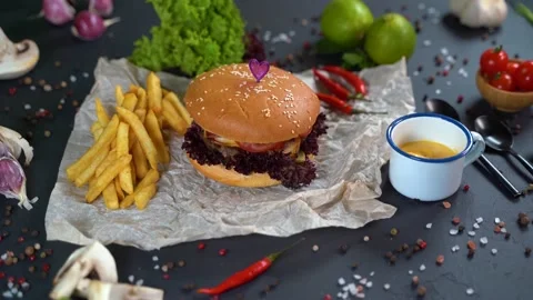 4K, hands take the hamburger next to the fries. 스톡 동영상 134739765