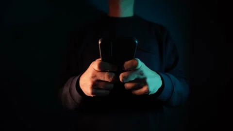 4K hands texting on mobile phone screen in the dark tone during the night Stock Footage 256218474