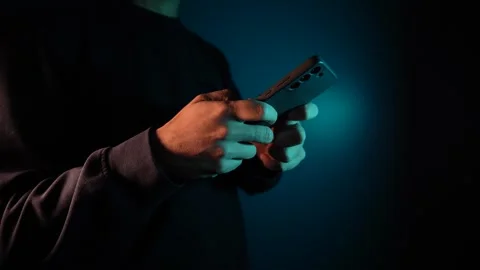 4K hands texting on mobile phone screen in the dark tone during the night Stock Footage 256233223