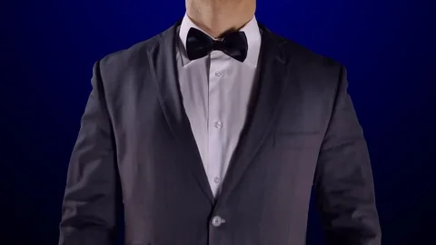 4K Handsome Confident Model Wearing Tuxedo, Fixing Bow Tie with Hands, Close Up Video stock 72333919