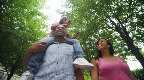 4K Happy African American family walking in urban park Stock Footage