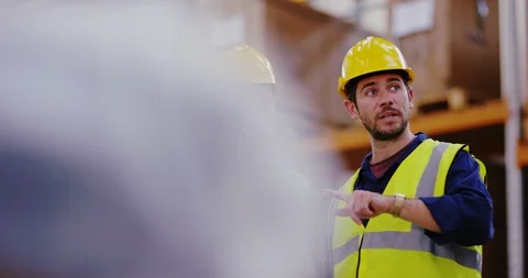 4K Happy co-workers in distribution warehouse looking at computer tablet Stock-Footage 102141862