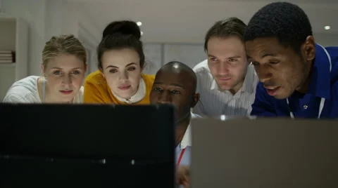 4K Happy engineering team working together, looking at computer screen 스톡 동영상 63320046