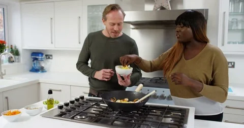 4K Happy extrovert TV presenters preparing a healthy meal for TV cookery show 스톡 동영상 75246984