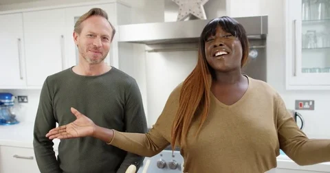4K Happy extrovert TV presenters preparing a meal for modern TV cookery channel 스톡 동영상 75293739