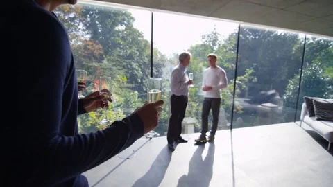 4K Happy group of friends at social event raise champagne glasses for a toast Stock Footage