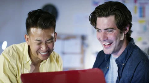 4K Happy male computer programmers working together give a high five Stock Footage 54470638