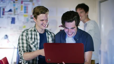 4K Happy male computer programmers working together give a high five Stock Footage 54478202