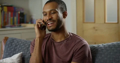 4K Happy smiling man at home making a friendly phone call. Slow motion. Stock Footage 82306032