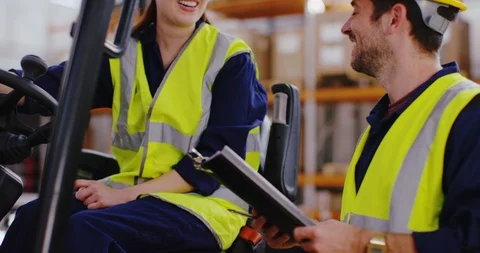 4K Happy warehouse workers, forklift truck driver having discussion with foreman Video stock 101937553
