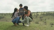 4K Happy Young Asian Family Spending Leisure Time Outdoors In The Countryside Stock Footage