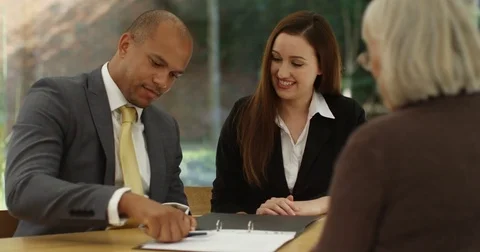 4K Happy young couple taking key to new home &amp; shaking hands with estate agent Stock Footage 81245842