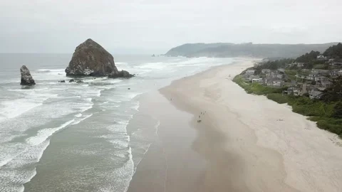 4K Haystack Rock on Cannon Beach, Oregon - 4K Aerial View Stock Footage 135553553