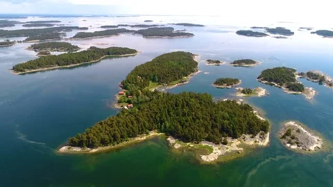 4K HD Aerial view camera moves forward above green forest islands Video stock 78572386