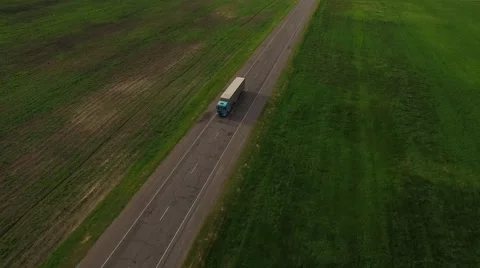 4K HD Aerial view flight over local two-line road with cargo truck lorry moving Stock Footage 63501156