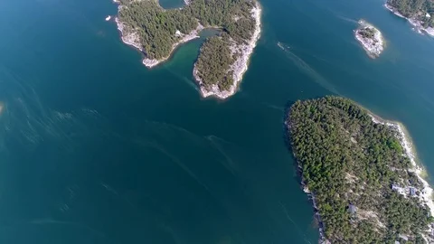 4K HD Aerial view of forest islands and sea at archipelago. Camera moves forward Stock Footage 78631392
