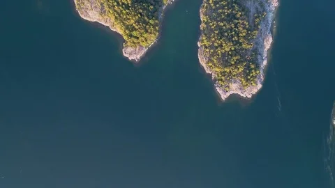 4K HD Aerial view of forest islands and sea at archipelago moments before sunset Stock Footage 78645982