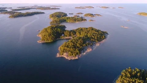 4K HD Aerial view of forest islands and sea at archipelago. Camera moves forward Stock Footage 79499232