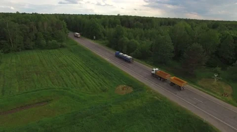 4K HD local road traffic trucks lorries vans cars drive one direction birds eye  Stock Footage 63501129