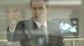 4K & HD resolutions: the businessman writes graphs on the glass board 4k or 4k+ Resolution