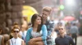4K & HD resolutions: Lovers stand above the crowd stream at the street, summer HD Footage