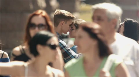4K &amp; HD resolutions, SLOW MOTION: Lovers stand above the crowd at the street Stock Footage 40382820