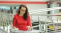 4K & HD resolutions; Young woman has coffee break at the trade center HD Footage