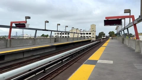 4K HD video of BART train coming into Fruitvale Station in Oakland, CA Stock Footage 252094123