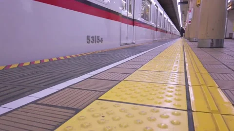 4k HD video while tokyo subway train approaching to platform Stock Footage 159355632