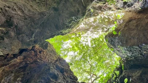4K Heart-Shaped Cave Opening with Sunlight in Okinawa, Japan Stock Footage 345378769
