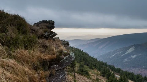 4K Heavy clouds and rock formation Stock Footage 126015686