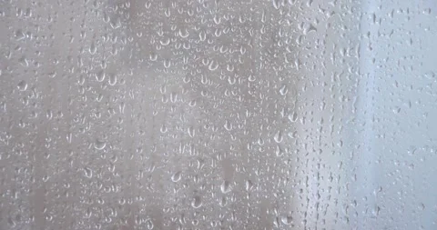 4k heavy Rain Drops Falling down on window glass Stock Footage 261298045