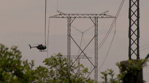 4K - Helicopter performing high voltage cable inspection Video stock 39428923