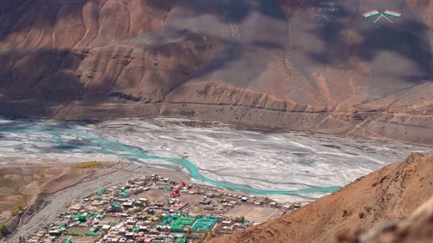 4K high angle shot of spiti river flowing besides the Kaza town Stock Footage 237170660