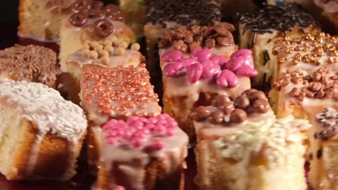 4K High Angle View of Assorted Decorated Cakes Rotating Fast to the Left 스톡 동영상 333319067