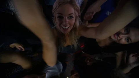 4K High angle view party crowd dancing in the club &amp; looking up to camera Stock Footage 72608481