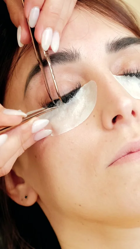 4k high angle view video of beautician putting lashes extension Stock Footage 272234337