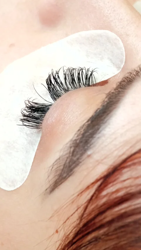 4k high angle view video of beautician putting lashes extension Stock Footage 272234342