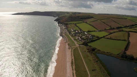 4K High Flight Along Beach on the South Devon Coast Stock Footage