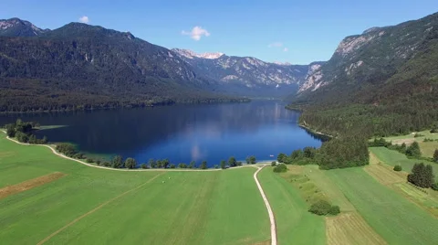 4K. High flight and takeoff above amazing Bohinj Lake in the morning. Video stock 66128669